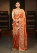 Banarasi Semi Tissue Silk Saree in Orange – Elegant Lace Border & Zari Detailing